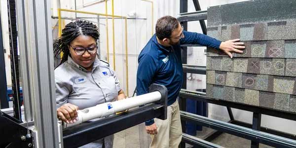 Woman and Man lab testing shingles